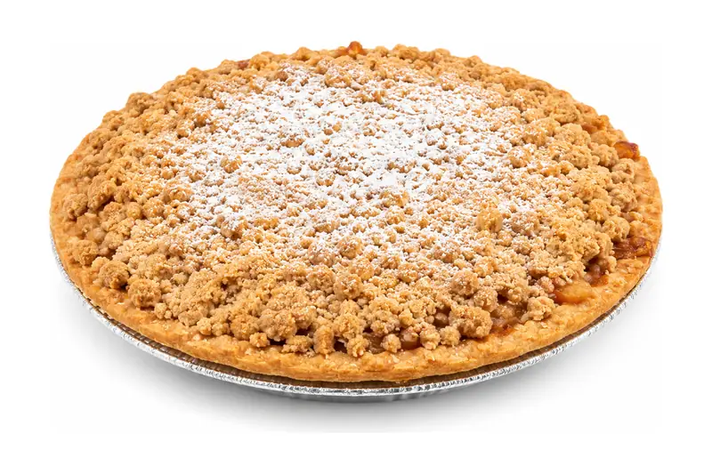 Whole crumb-topped apple pie dusted with powdered sugar