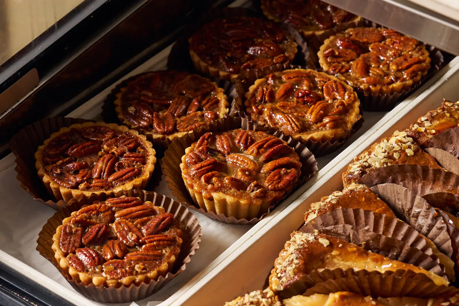 Trays of pecan pies in the Saffron bakery case